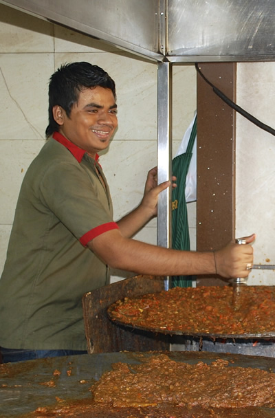 street vendor preparing dal makhani